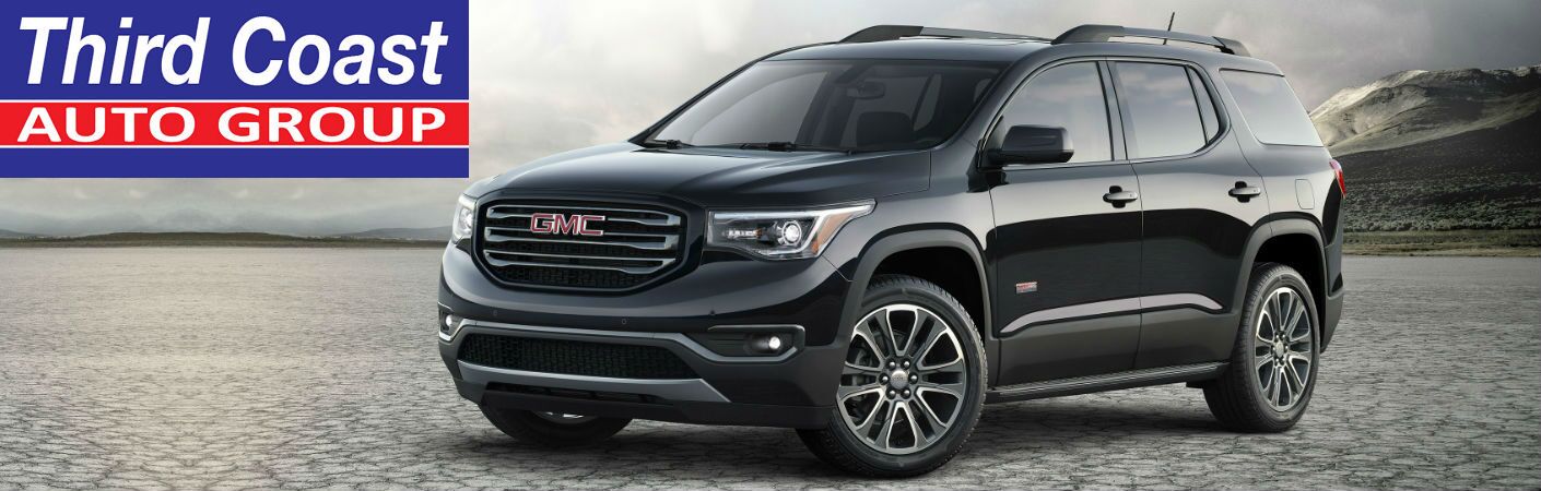 GMC Acadia exterior side angled view with "Third Coast Auto Group" logo in the upper left.