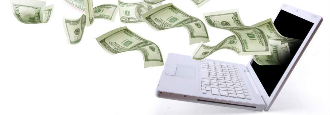 money streaming out of a computer