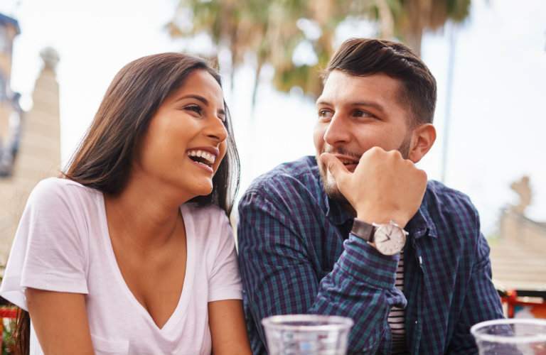hispanic couple having fun at a a restaurant