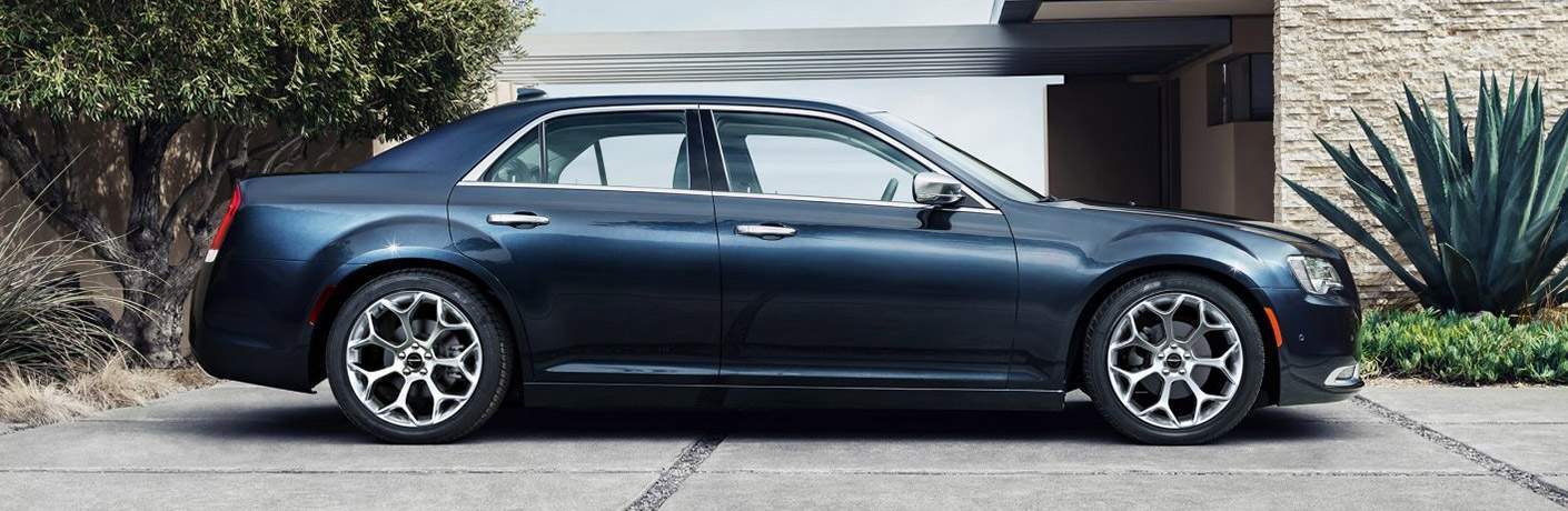 2017 Chrysler 300 parked in front of a garage
