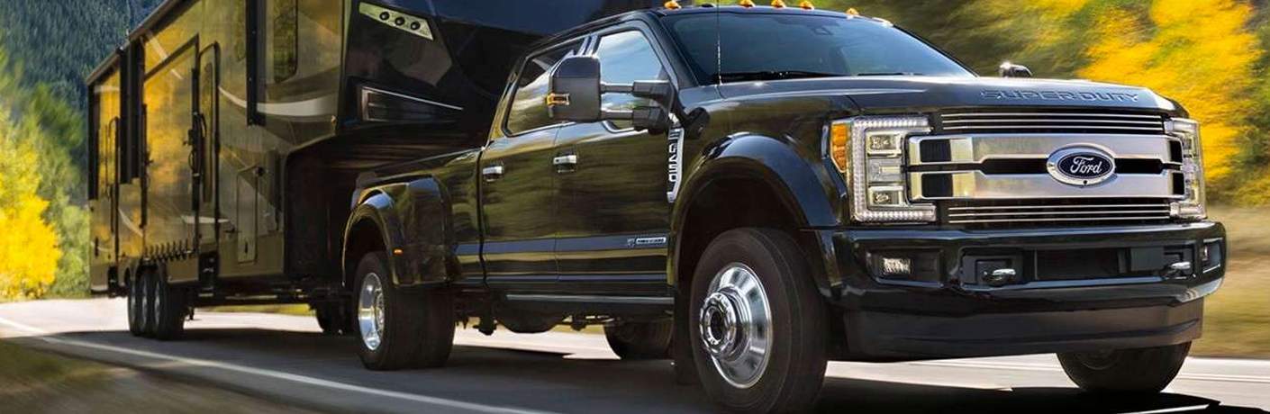 2018 Ford F-250 in black hauling an RV