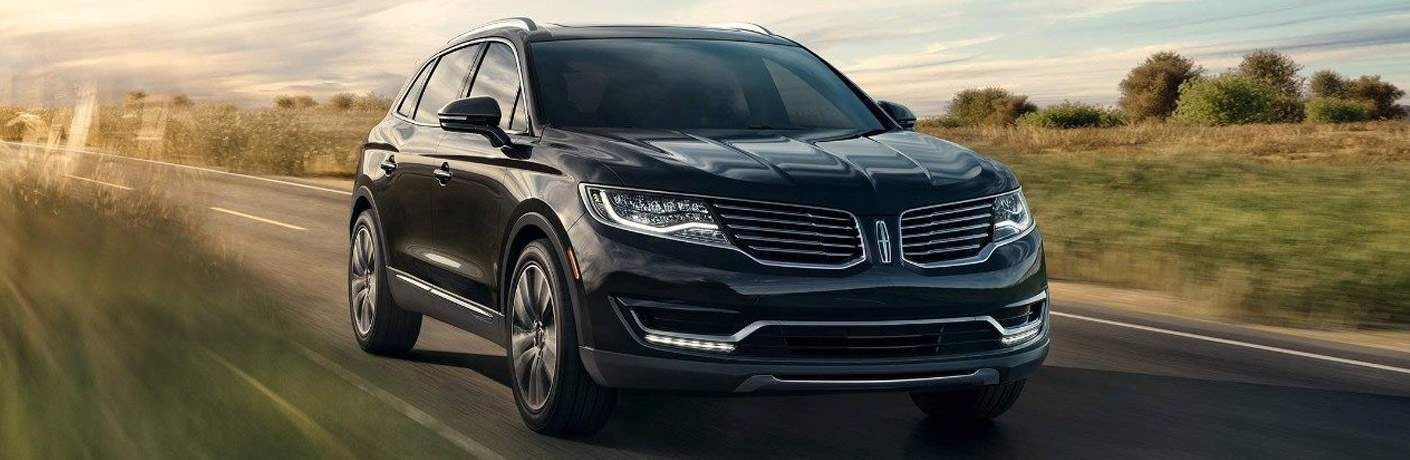 2018 Lincoln MKX in black driving on a country road