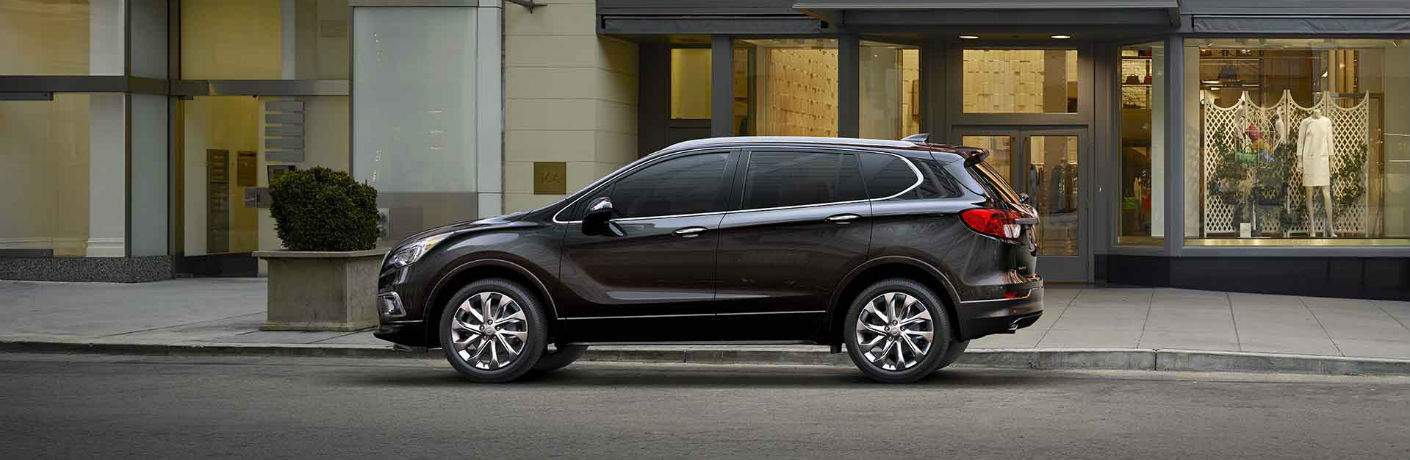 2018 Buick Envision in grey parked in front of a store