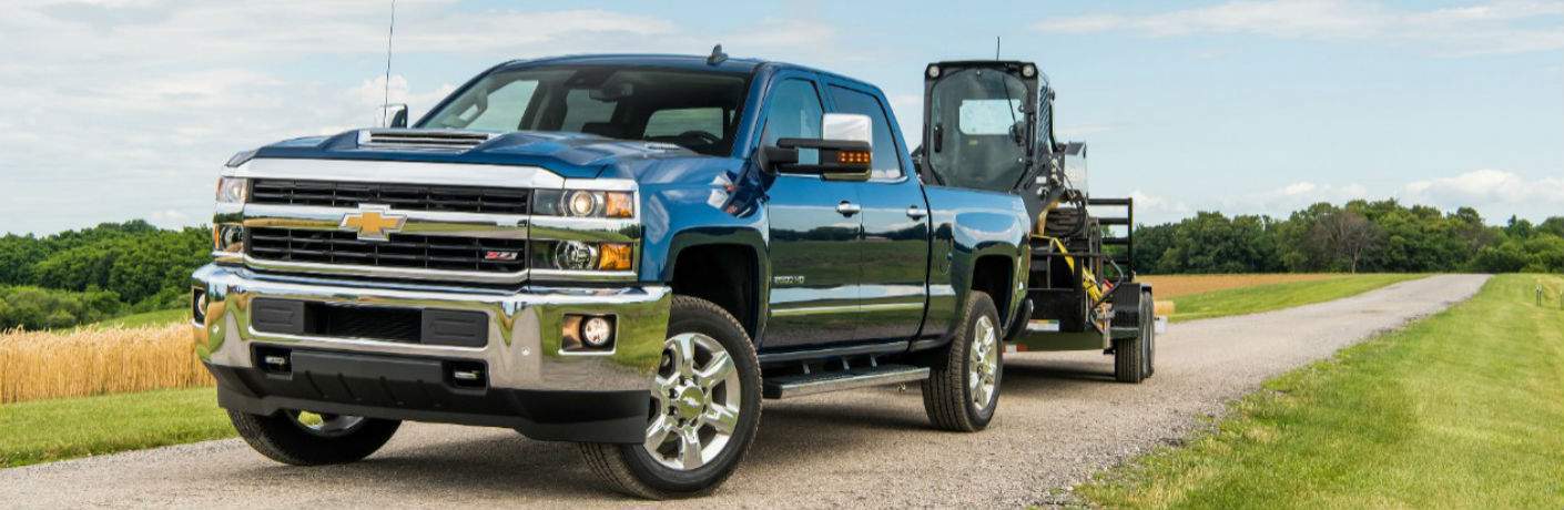 Chevy Silverado 2500HD towing a tractor