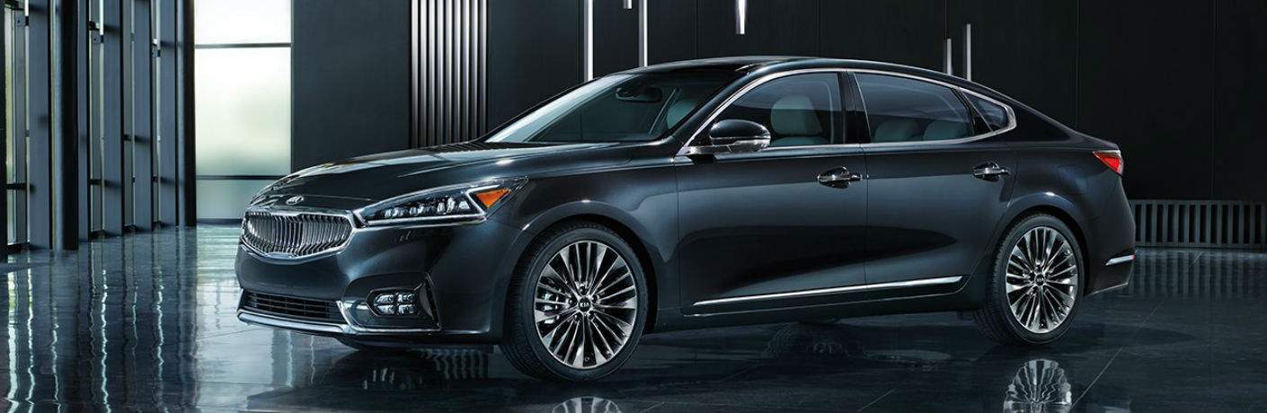 2018 Kia Cadenza in black sitting in a dark showroom