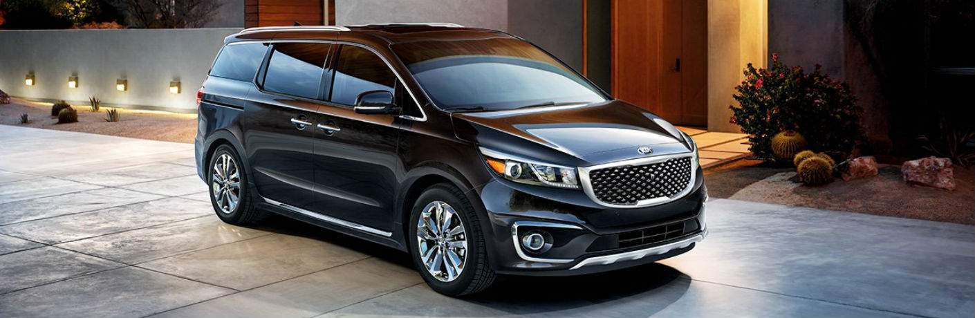 2018 Kia Sedona sitting on a large concrete driveway