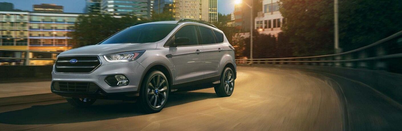 2019 Ford Escape driving on the highway at dusk