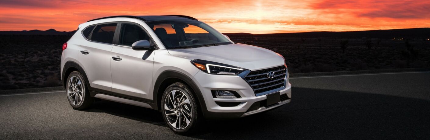 2019 Hyundai Tucson parked in front of an orange sunset
