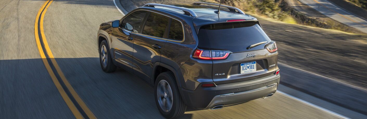 2019 Jeep Cherokee model driving on a windy mountain road