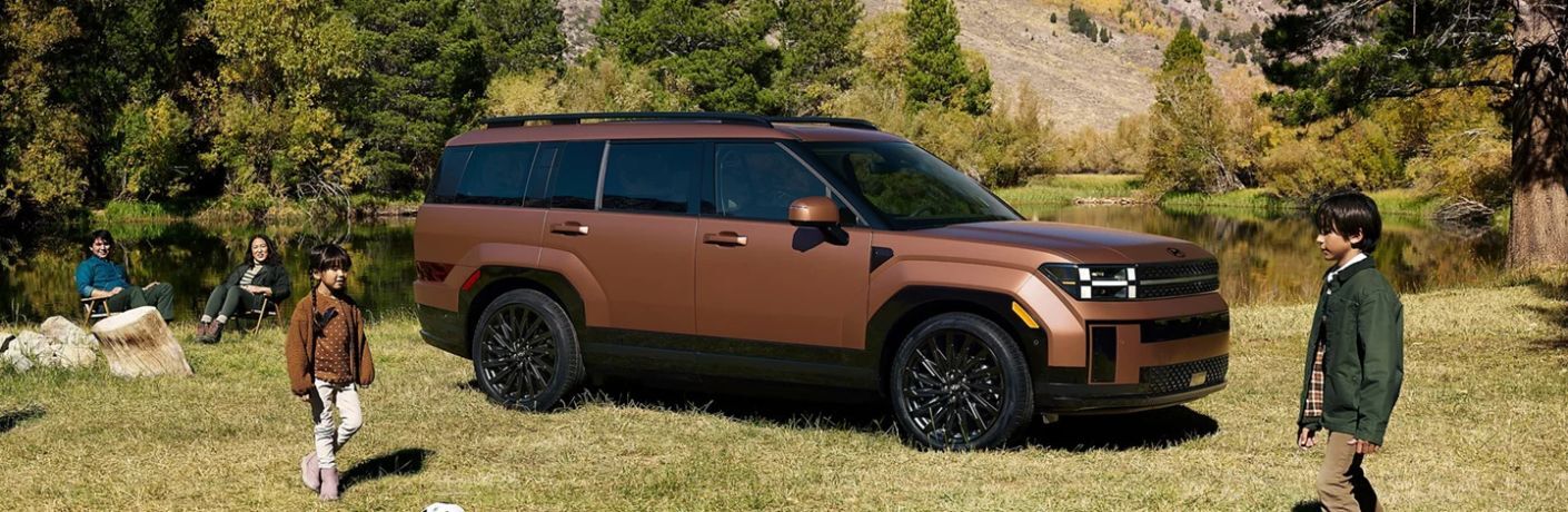 2026 Hyundai Santa Fe with people outdoors