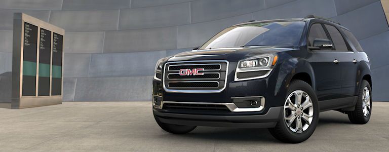 GMC Acadia parked near a building