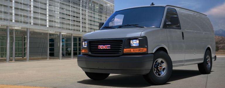 White GMC Savana van parked on the street