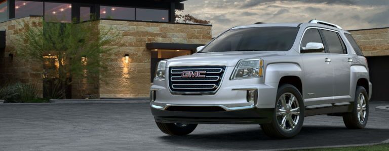 GMC Terrain parked near a building