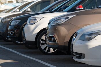 a line of the fronts of cars in a lot