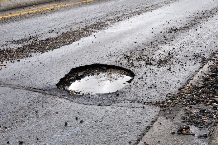 a round pothole filled with water