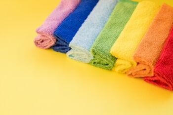 a row of microfiber cleaning cloths in rainbow colors