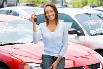 woman smiling with her new keys