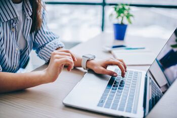 woman typing on computer