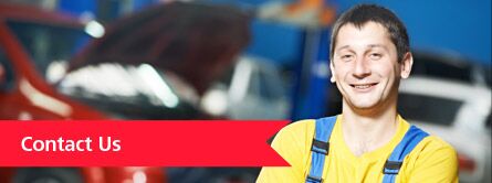 man smiling in yellow shirt, contact us link