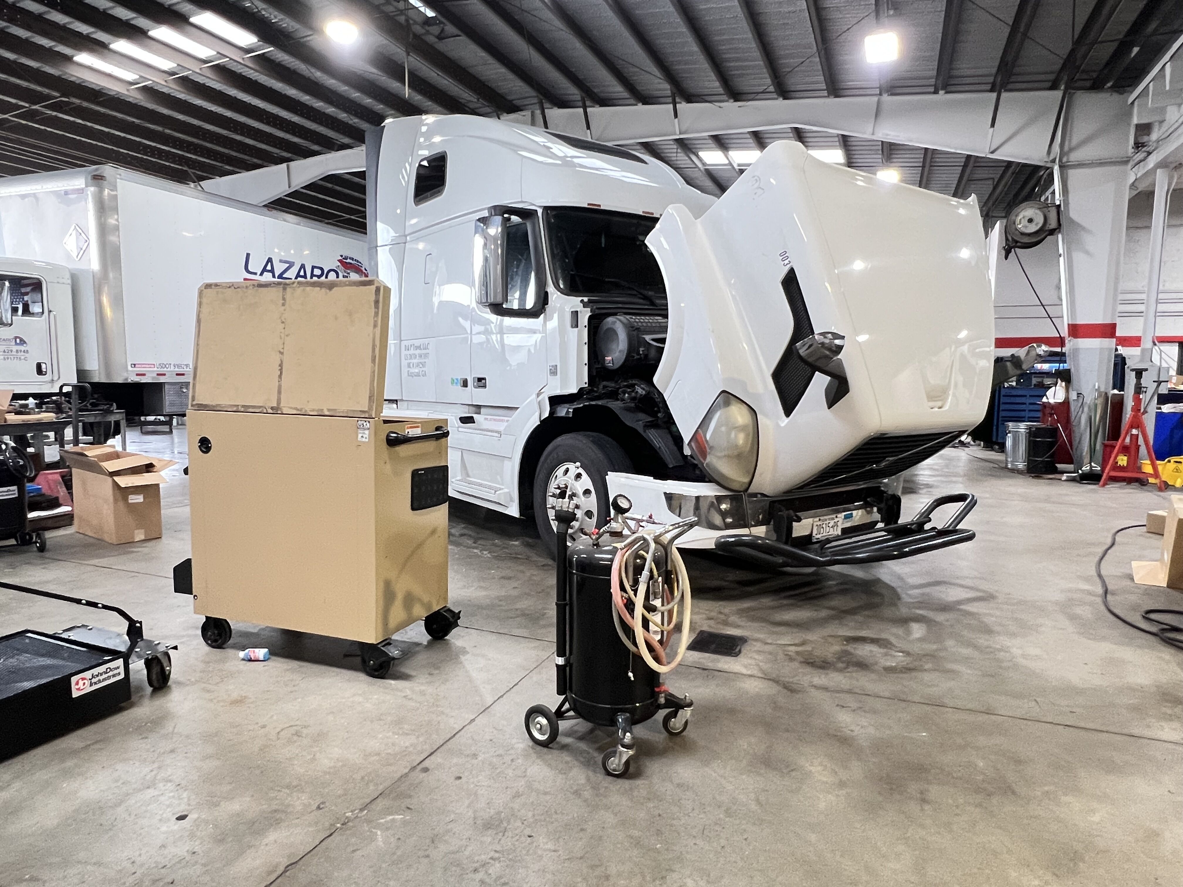 A man running diagnostics on a commercial truck