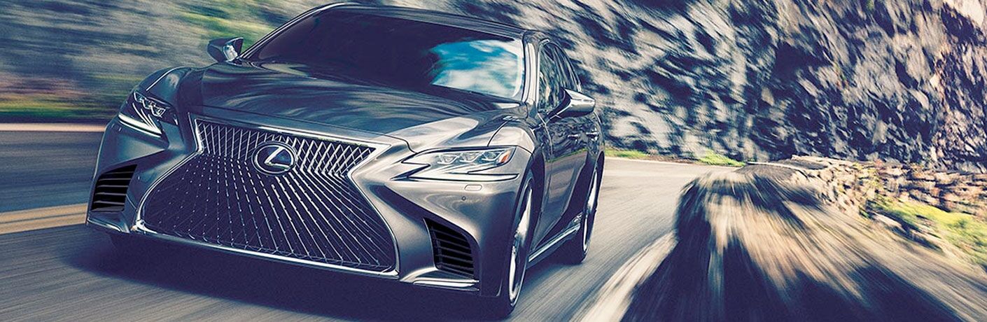 2020 Lexus LS exterior front shot closeup while racing down a cliffside highway