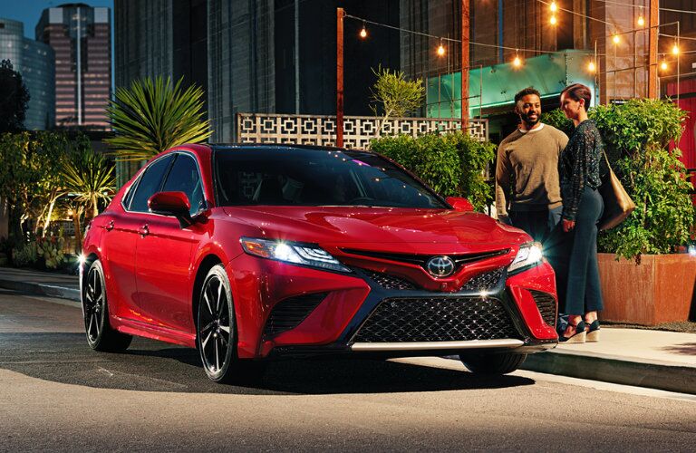 Red 2018 Toyota Camry Parked by a Curb