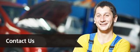 Contact Us Title and a Smiling Technician