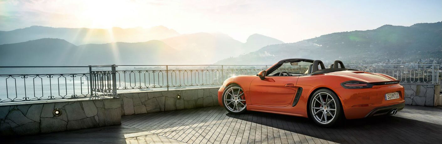 2019 Porsche 718 Boxster parked to overlook a city and mountain lake