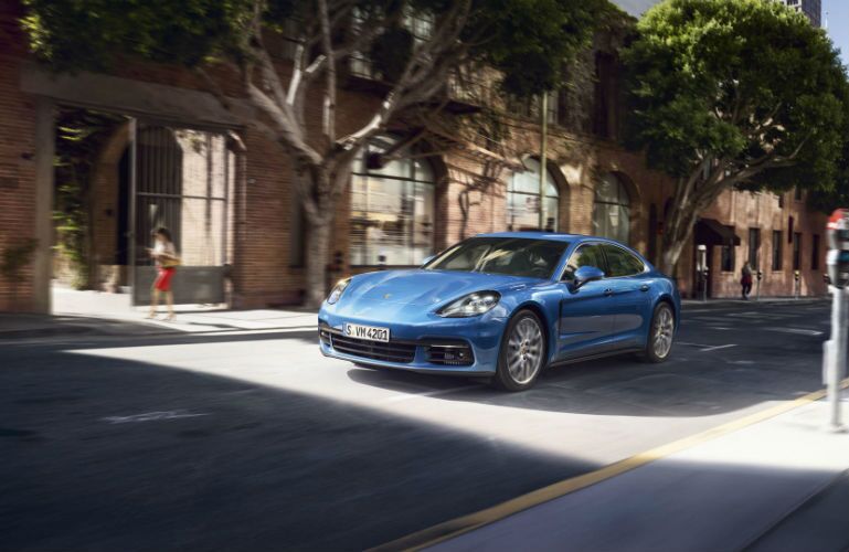 2019 Porsche Panamera driving on a one-way road