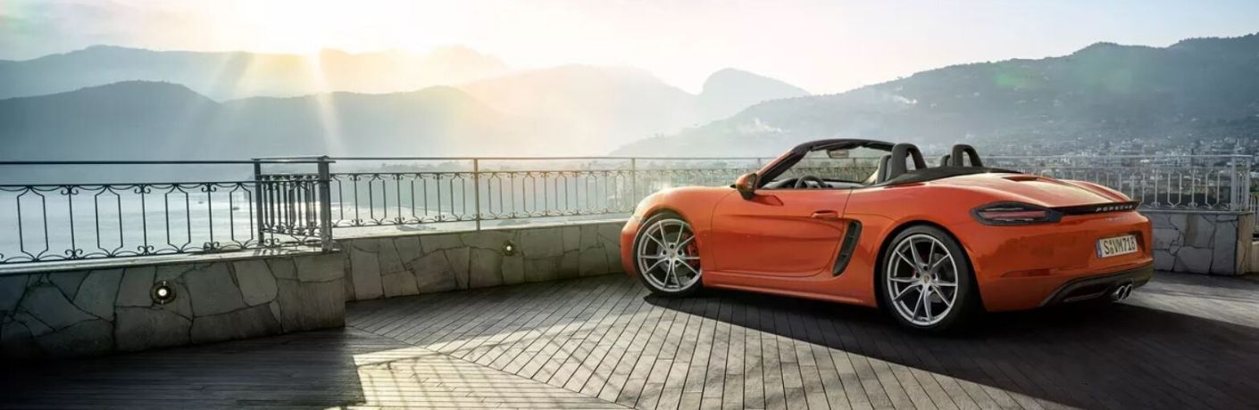 Exterior view of an orange 2020 Porsche 718 Boxster