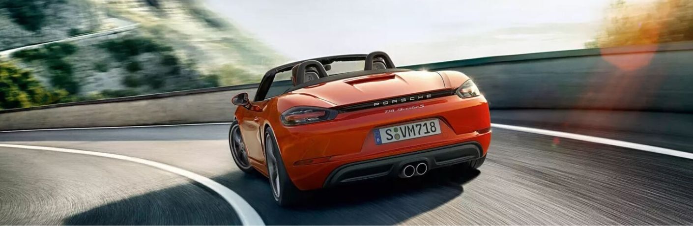 2020 Porsche Boxster driving rear view