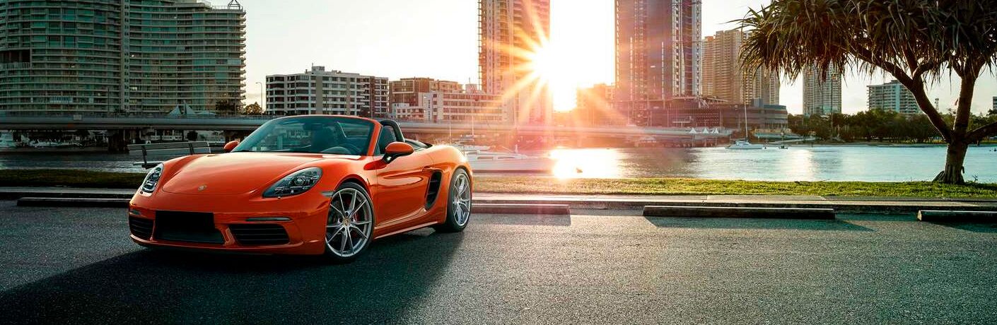 2021 Porsche 718 Cayman with big city buildings in the background
