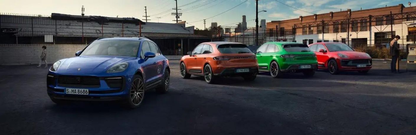 Four 2022 Porsche Macan in a parking lot