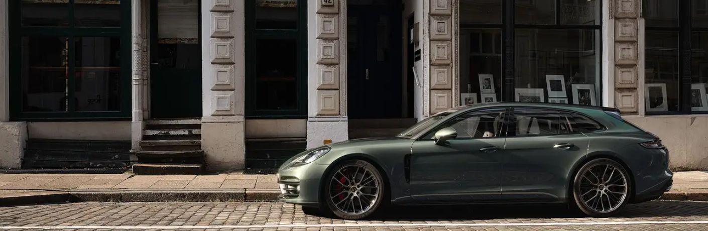 An image of the side view of a grey colored 2023 Porsche Panamera