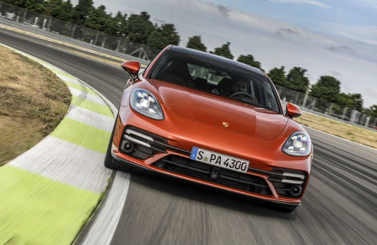 A head-on photo of the 2021 Porsche Panamera on a race track.