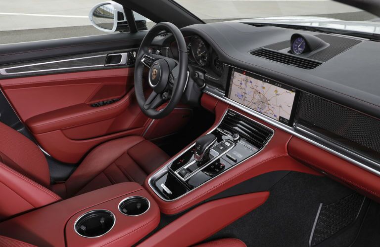 A photo of the dashboard and driver's cockpit in the 2021 Porsche Panamera.