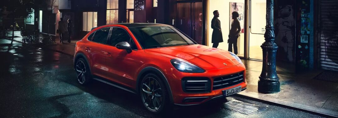 2020 Porsche Cayenne Coupe on city street at night