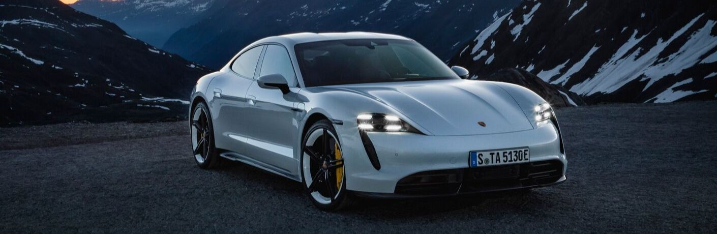 White 2020 Porsche Taycan Front Exterior in Front of Mountains