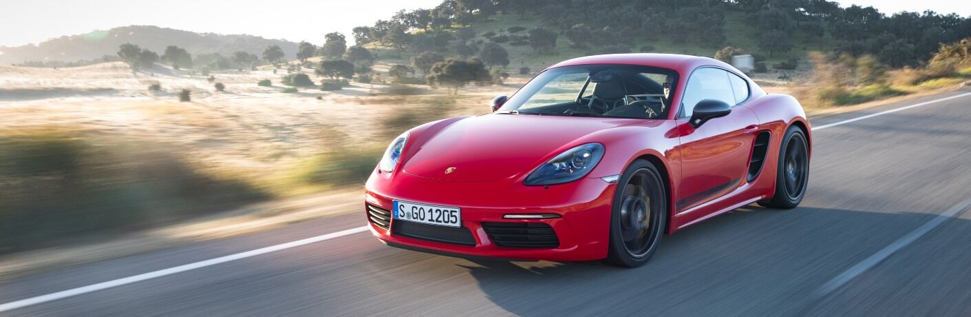 2020 Porsche 718 Boxster driving down highway toward camera