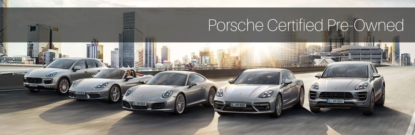 row of Porsche vehicles driving down road with "Porsche Certified Pre-Owned" Text
