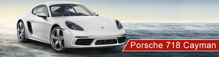 white 2018 Porsche 718 Cayman with banner