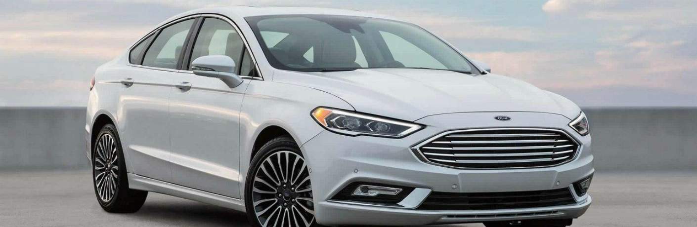 Used Fusion Oxford White parked in a parking lot