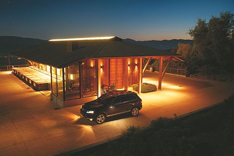night shot of Volkswagen Touareg parked next to building