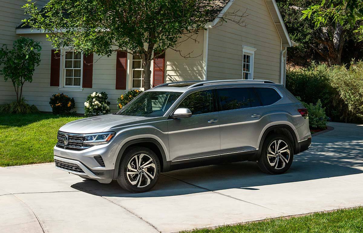 An Atlas is parked in the driveway of a home.
