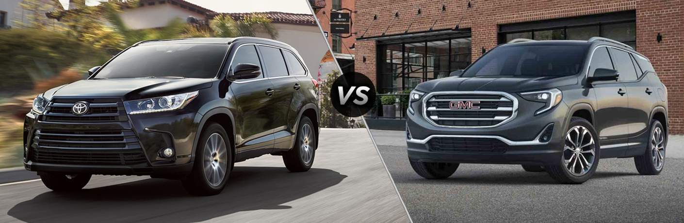 2018 Toyota Highlander and 2018 GMC Terrain shown in comparison shot next to one another on empty roads