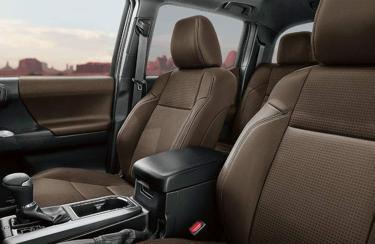 Front two seats of 2018 Toyota Tacoma with prominent gear shifter