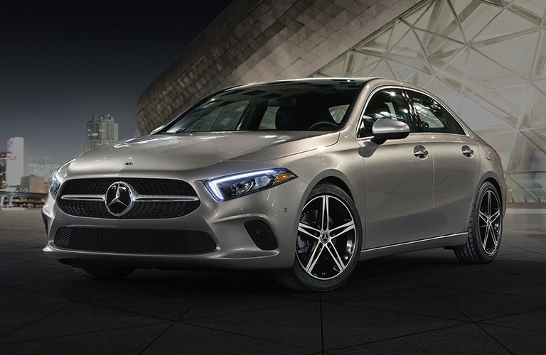 2019 MB A-Class exterior front fascia and driver side in city at night