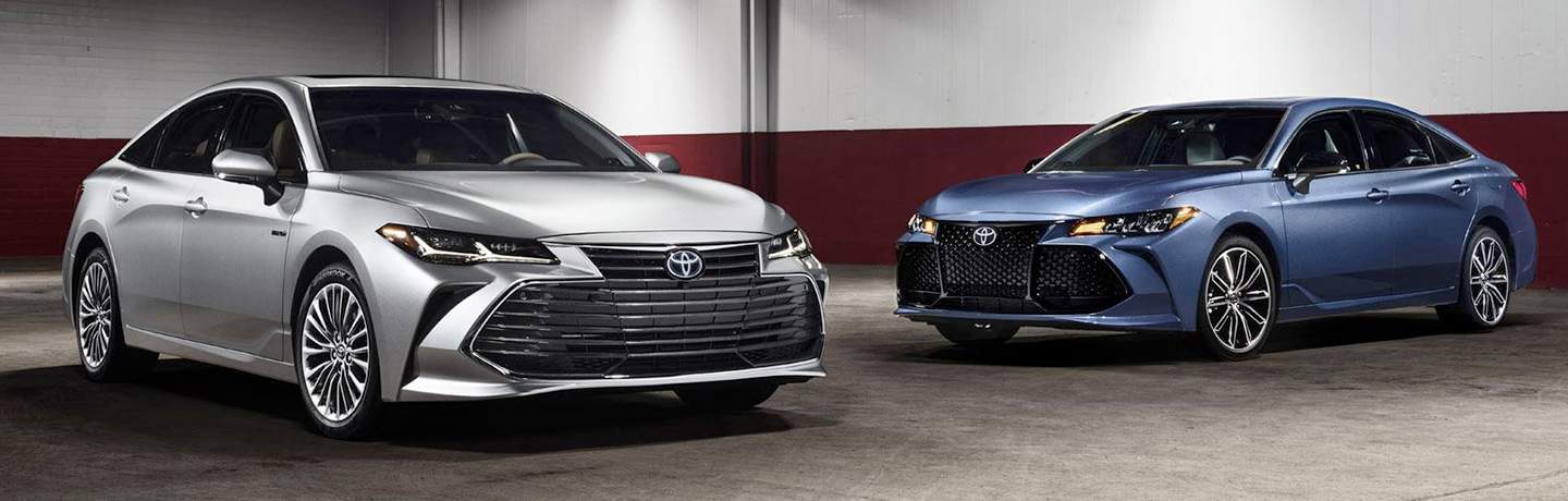 Silver and blue 2019 Toyota Avalon models positioned next to each other