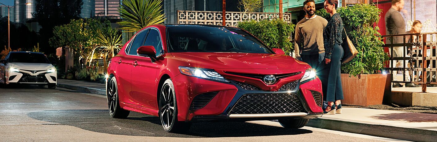 Two people getting into a 2019 Toyota Camry