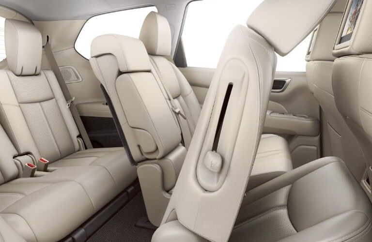 Passenger angle of the interior seats in the 2019 Nissan Pathfinder with the closest second-row seat slid and tilted forward